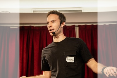 Riccardo Capraro speaking at a conference